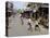 Children Play Soccer on One of the Streets of the Business District of Lagos-null-Stretched Canvas