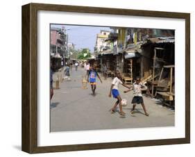 Children Play Soccer on One of the Streets of the Business District of Lagos-null-Framed Photographic Print