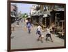 Children Play Soccer on One of the Streets of the Business District of Lagos-null-Framed Photographic Print