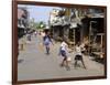 Children Play Soccer on One of the Streets of the Business District of Lagos-null-Framed Photographic Print