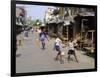 Children Play Soccer on One of the Streets of the Business District of Lagos-null-Framed Photographic Print