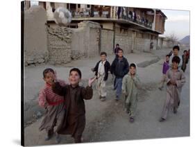 Children Play with a Soccer Ball-null-Stretched Canvas