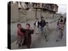 Children Play with a Soccer Ball-null-Stretched Canvas