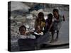 Children Play with a Suitcase Near a Camp for People Displaced by the Earthquake in Port-Au-Prince-null-Stretched Canvas