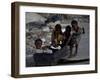 Children Play with a Suitcase Near a Camp for People Displaced by the Earthquake in Port-Au-Prince-null-Framed Photographic Print