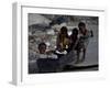 Children Play with a Suitcase Near a Camp for People Displaced by the Earthquake in Port-Au-Prince-null-Framed Photographic Print