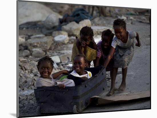 Children Play with a Suitcase Near a Camp for People Displaced by the Earthquake in Port-Au-Prince-null-Mounted Photographic Print
