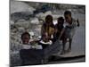 Children Play with a Suitcase Near a Camp for People Displaced by the Earthquake in Port-Au-Prince-null-Mounted Photographic Print