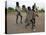 Children Play with Homemade Soccer Balls Made from Discarded Medical Gloves-null-Stretched Canvas