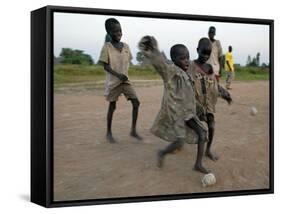 Children Play with Homemade Soccer Balls Made from Discarded Medical Gloves-null-Framed Stretched Canvas