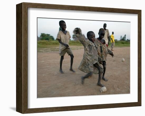 Children Play with Homemade Soccer Balls Made from Discarded Medical Gloves-null-Framed Photographic Print