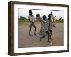 Children Play with Homemade Soccer Balls Made from Discarded Medical Gloves-null-Framed Photographic Print