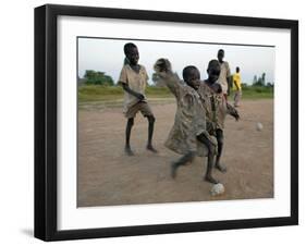 Children Play with Homemade Soccer Balls Made from Discarded Medical Gloves-null-Framed Photographic Print