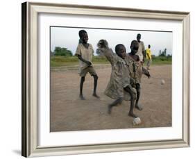 Children Play with Homemade Soccer Balls Made from Discarded Medical Gloves-null-Framed Photographic Print