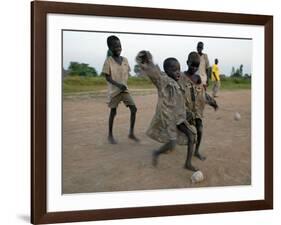 Children Play with Homemade Soccer Balls Made from Discarded Medical Gloves-null-Framed Photographic Print