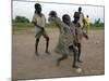Children Play with Homemade Soccer Balls Made from Discarded Medical Gloves-null-Mounted Photographic Print