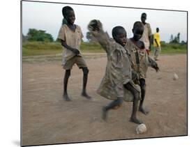 Children Play with Homemade Soccer Balls Made from Discarded Medical Gloves-null-Mounted Photographic Print