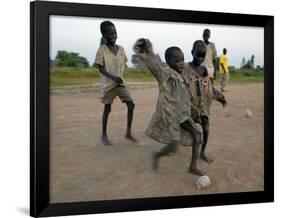 Children Play with Homemade Soccer Balls Made from Discarded Medical Gloves-null-Framed Photographic Print