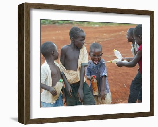 Children Play with Water Near a Zimbabwean Movement for Democratic Change (MDC) Election Rally-null-Framed Photographic Print