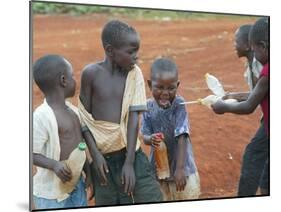 Children Play with Water Near a Zimbabwean Movement for Democratic Change (MDC) Election Rally-null-Mounted Photographic Print