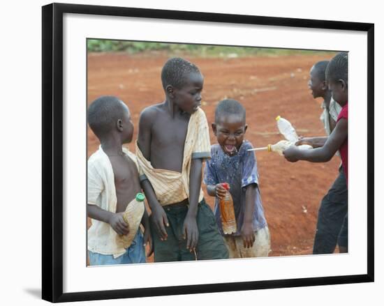 Children Play with Water Near a Zimbabwean Movement for Democratic Change (MDC) Election Rally-null-Framed Photographic Print