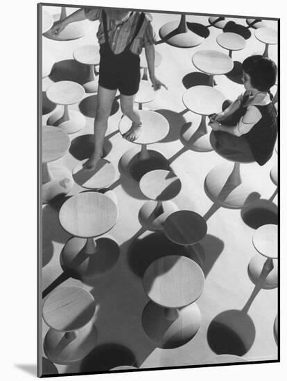 Children Playing Atop Modern Furniture-Michael Rougier-Mounted Photographic Print