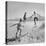 Children Playing in the Desert Sand-Nat Farbman-Stretched Canvas