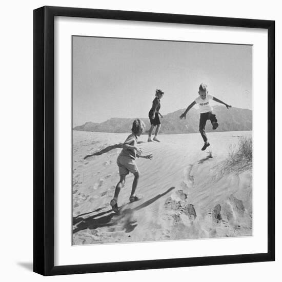 Children Playing in the Desert Sand-Nat Farbman-Framed Photographic Print