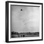 Children Playing with Kite That Releases Toys While in the Air-Bernard Hoffman-Framed Photographic Print