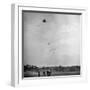 Children Playing with Kite That Releases Toys While in the Air-Bernard Hoffman-Framed Photographic Print