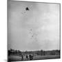 Children Playing with Kite That Releases Toys While in the Air-Bernard Hoffman-Mounted Photographic Print