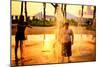 Children Playing with Water Fountains in Battery Park at Sunset,-Sabine Jacobs-Mounted Photographic Print