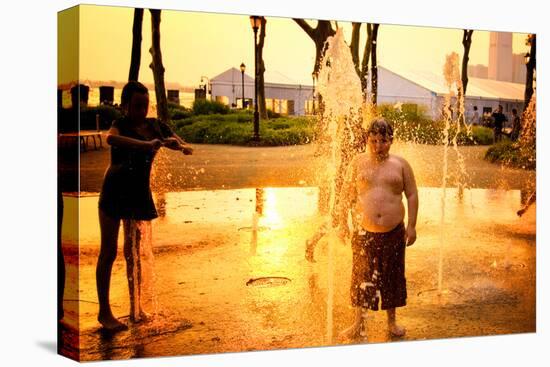Children Playing with Water Fountains in Battery Park at Sunset,-Sabine Jacobs-Stretched Canvas