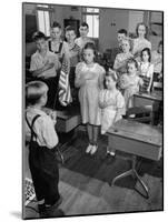 Children Reciting the Pledge of Allegiance as a Boy Holds the Us Flag in their Classroom-Bernard Hoffman-Mounted Photographic Print