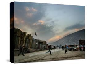 Children Run Across the Street as Spring Temperatures Return to Kabul-null-Stretched Canvas
