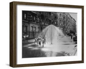 Children Running Around under Sprinkler in Street to Cool Off During Summer, in South Harlem-null-Framed Photographic Print