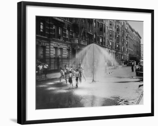 Children Running Around under Sprinkler in Street to Cool Off During Summer, in South Harlem-null-Framed Photographic Print