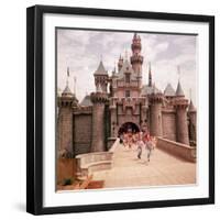 Children Running Through Gate of Sleeping Beauty's Castle at Walt Disney's Theme Park, Disneyland-Allan Grant-Framed Photographic Print