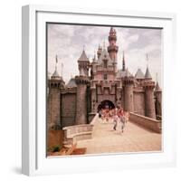 Children Running Through Gate of Sleeping Beauty's Castle at Walt Disney's Theme Park, Disneyland-Allan Grant-Framed Photographic Print