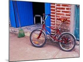 Children's Bicycle in Puerto Vallarta, The Colonial Heartland, Mexico-Tom Haseltine-Mounted Photographic Print