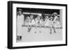 Children Sit on Wall in Front of Stands at the Ballpark and Eat Ice Cream Cones.-null-Framed Art Print