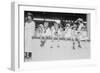 Children Sit on Wall in Front of Stands at the Ballpark and Eat Ice Cream Cones.-null-Framed Art Print