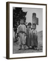 Children Standing in Front of Boundary Zone Sign Written in Russian, English, and Korean-John Florea-Framed Photographic Print