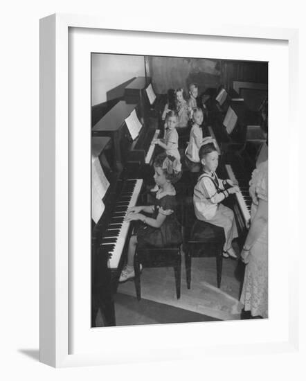 Children Taking Piano Lessons-George Strock-Framed Photographic Print