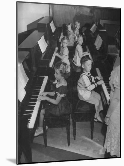 Children Taking Piano Lessons-George Strock-Mounted Photographic Print