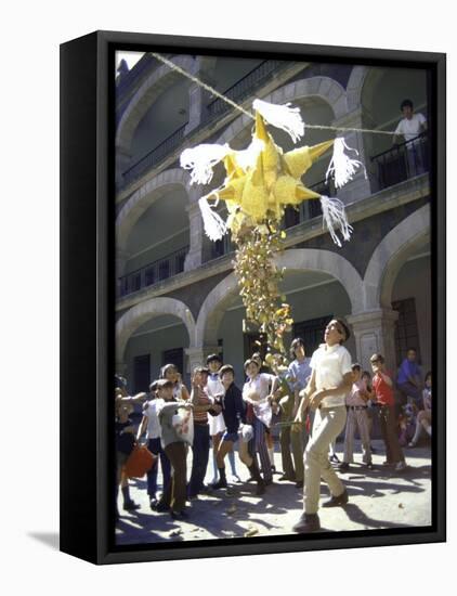 Children Taking Turns Breaking Pinata During Christmas Festival-John Dominis-Framed Stretched Canvas