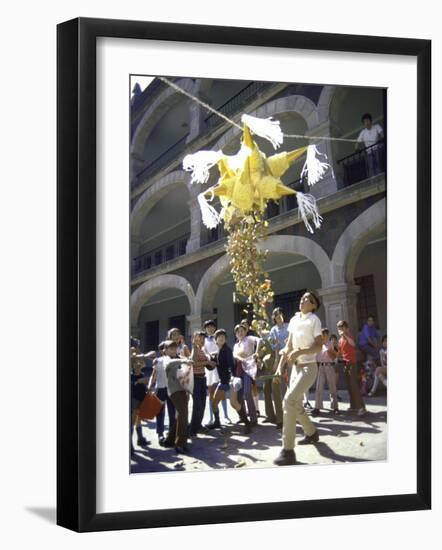 Children Taking Turns Breaking Pinata During Christmas Festival-John Dominis-Framed Photographic Print