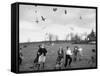 Children Trying to Catch Toys That Were Released by a Kite in the Air-Bernard Hoffman-Framed Stretched Canvas
