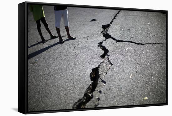 Children Walk Past a Crack Caused by the Earthquake in a Street in Port-Au-Prince-Carlos Barria-Framed Stretched Canvas