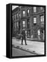 Children Watching a Policeman Walk His Beat in Front of Apartment Buildings-Ed Clark-Framed Stretched Canvas